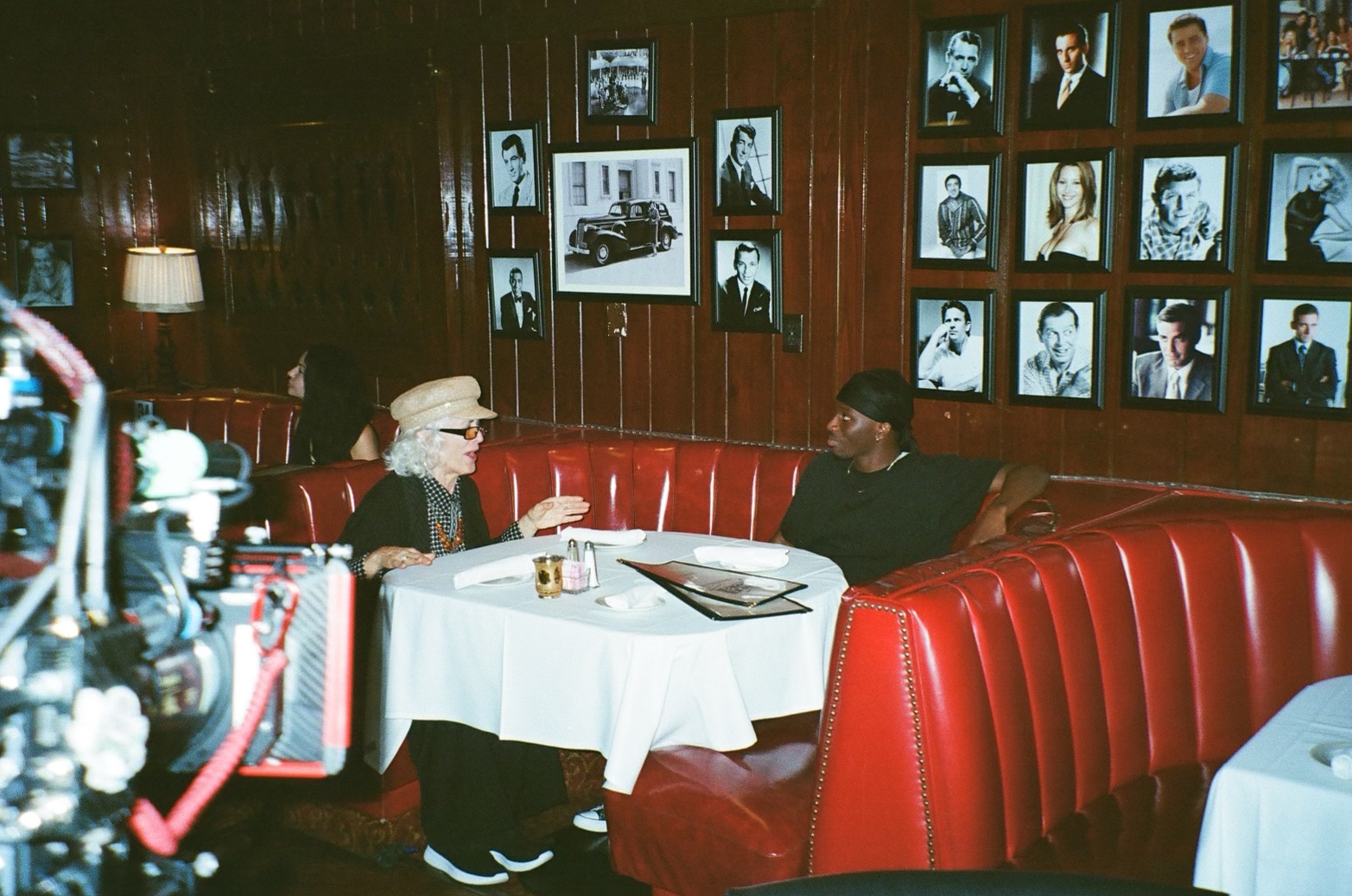 A cinematic production still inside a restaurant